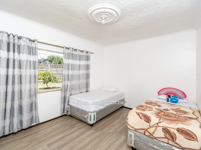 Strategically Located 4-Bedroom Family Home with Cottage – Sunridge, Harare Drive Frontage